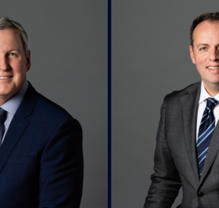 Split-screen portrait of two smiling businessmen in formal suits against a gray backdrop, one in navy and the other in gray.